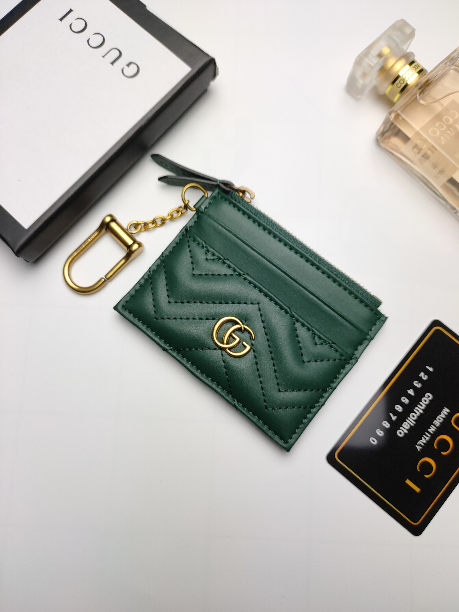 Gucci GG Marmont card case in green matelassé chevron leather with antique gold-toned hardware
