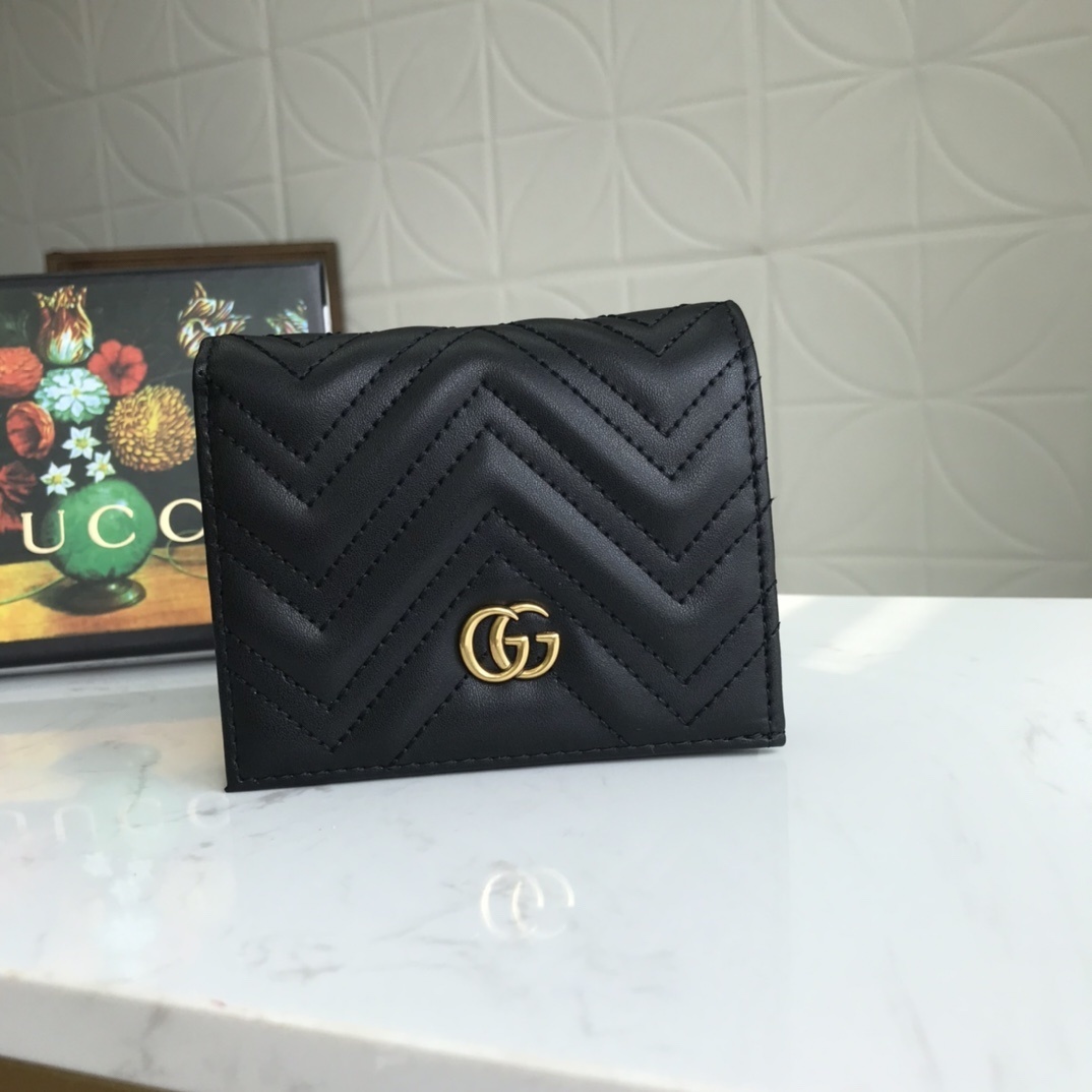 Gucci GG Marmont bifold card case wallet in black leather with gold-tone hardware