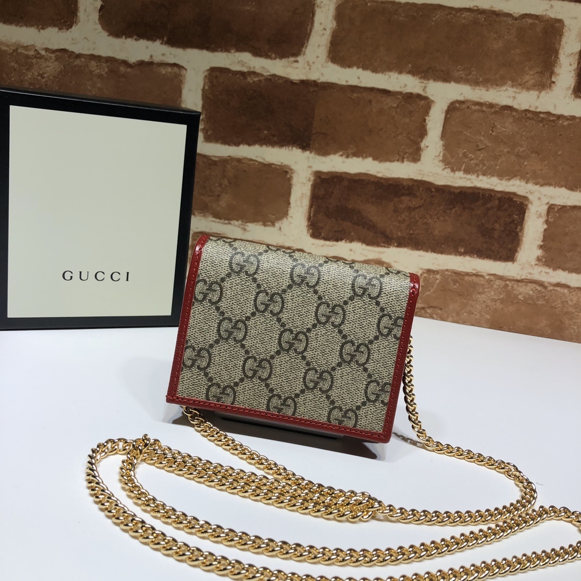 Gucci Horsebit 1955 wallet on-chain in beige and dark brown GG Supreme canvas with Rosso Ancora red leather trim and gold-tone hardware