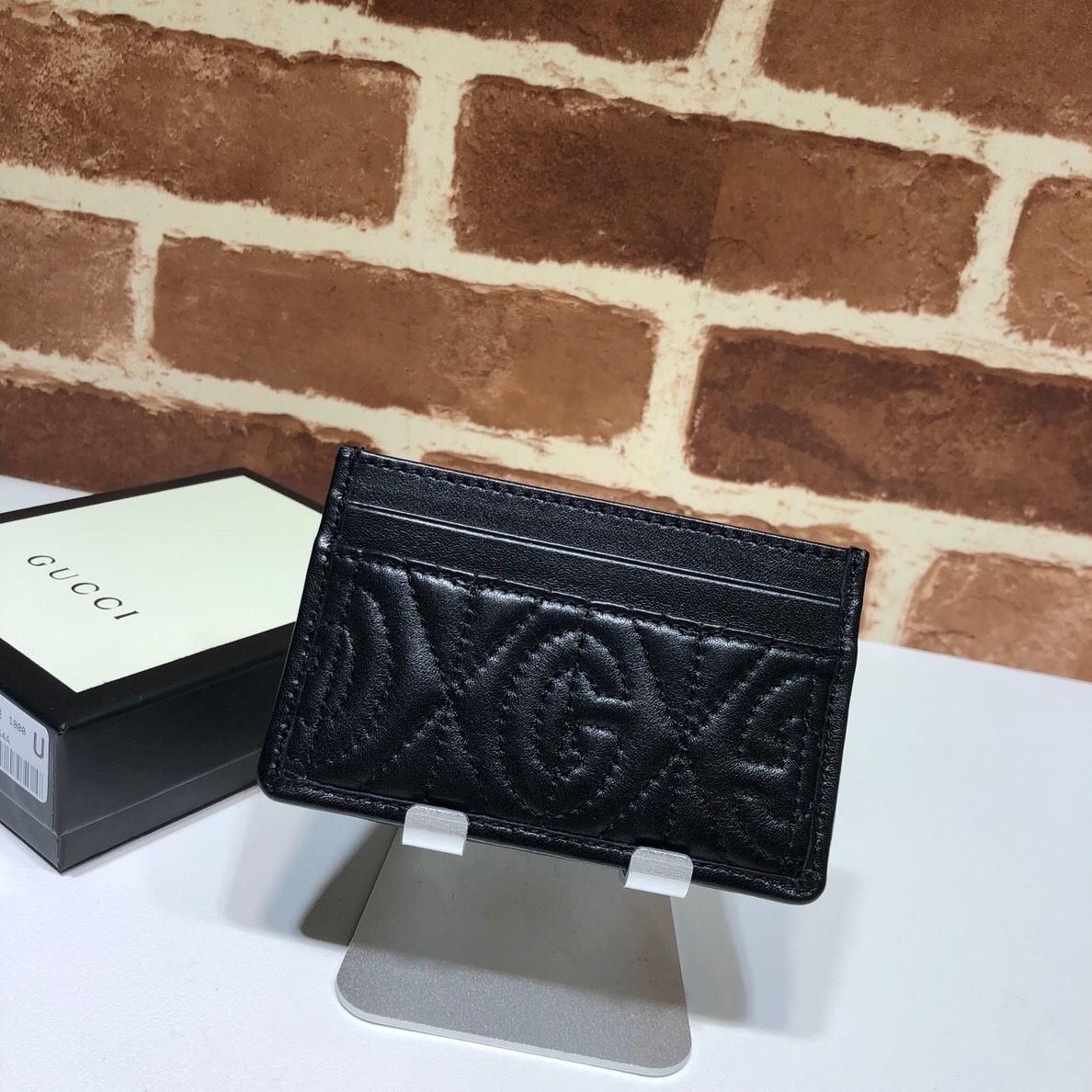 Gucci Rhombus quilted leather card holder in black