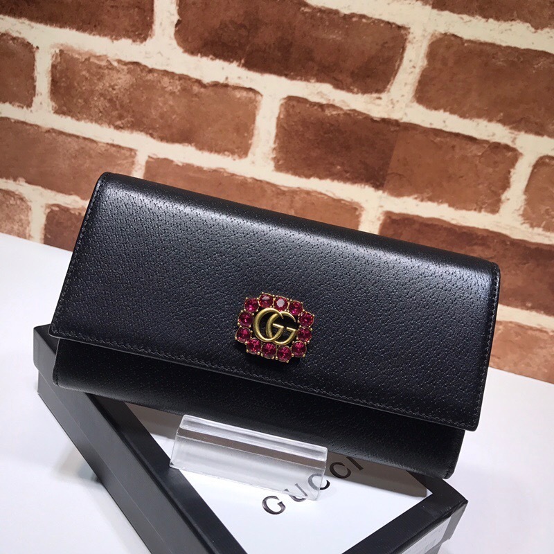 Gucci GG Marmont black leather bifold wallet with a rhinestone logo