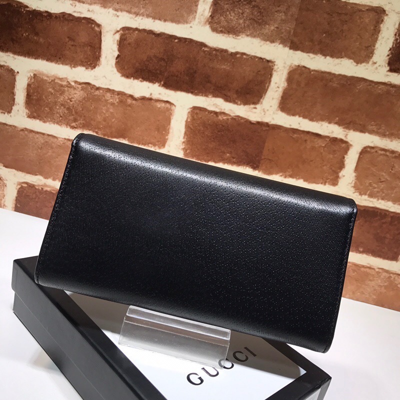 Gucci GG Marmont black leather bifold wallet with a rhinestone logo