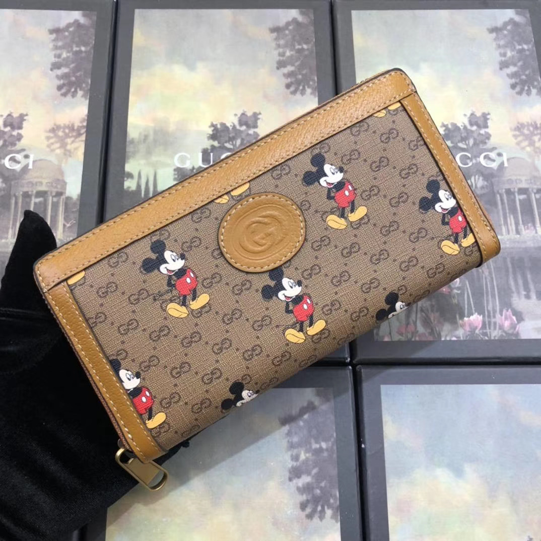 Gucci x Disney Mickey Mouse GG Supreme canvas zip-around long wallet with tan leather trim
