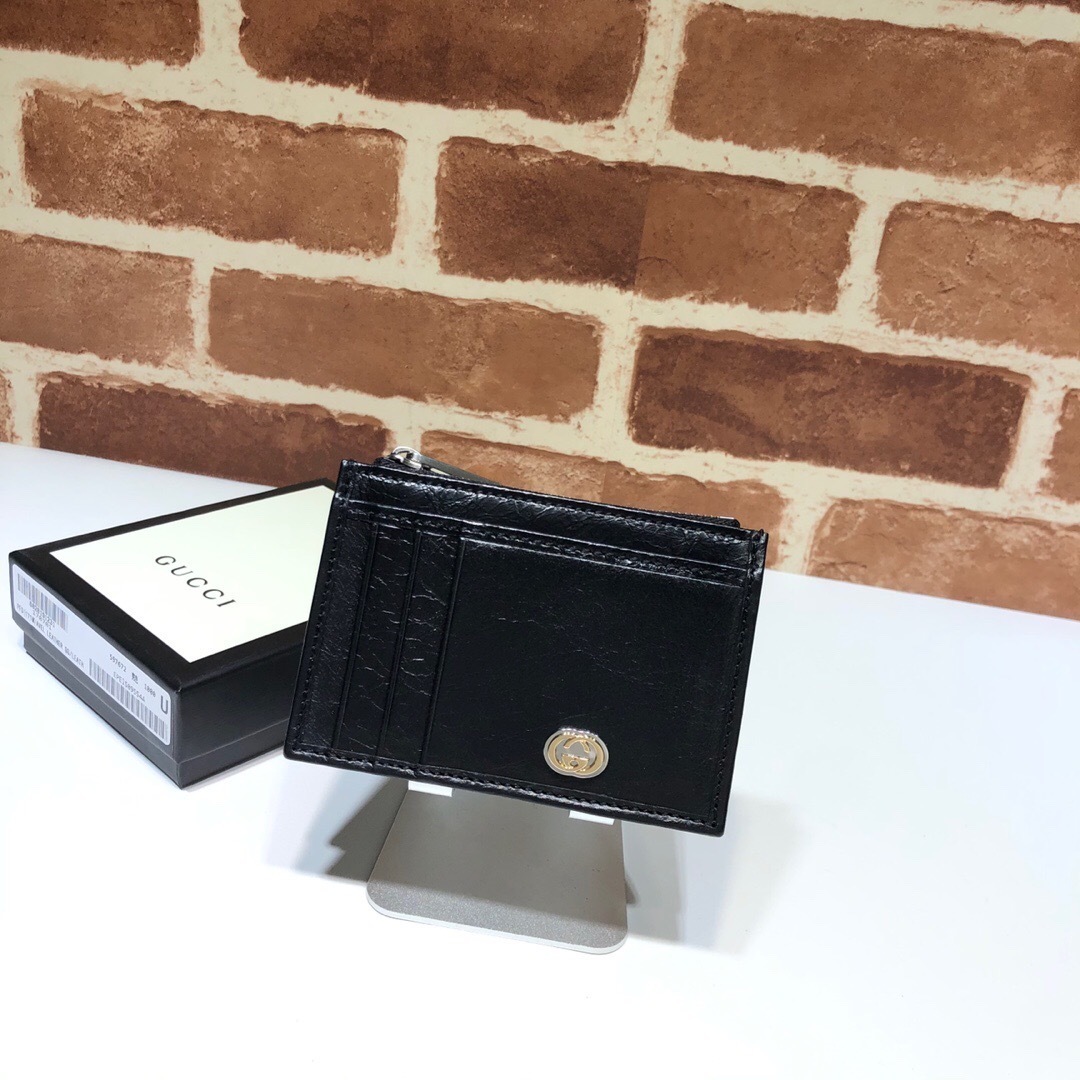 Gucci black leather card holder wallet with a small metallic logo