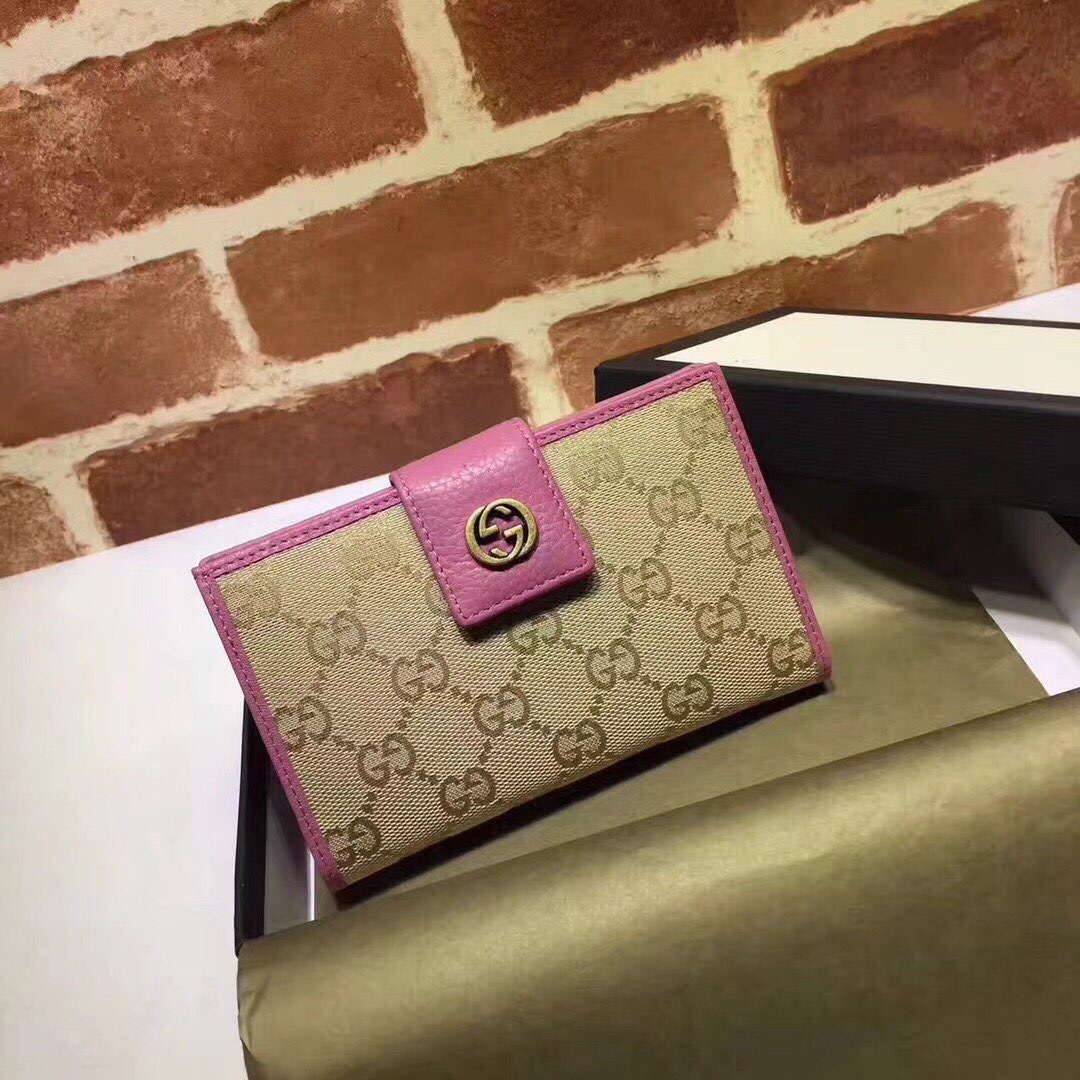 Gucci Monogram Miss GG Continental wallet in beige and ebony canvas with a fuchsia (or lilac/purple) leather trim