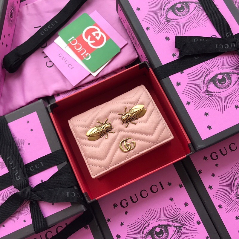 Gucci GG Marmont matelassé leather card case wallet with cicada stud details in a light pink color