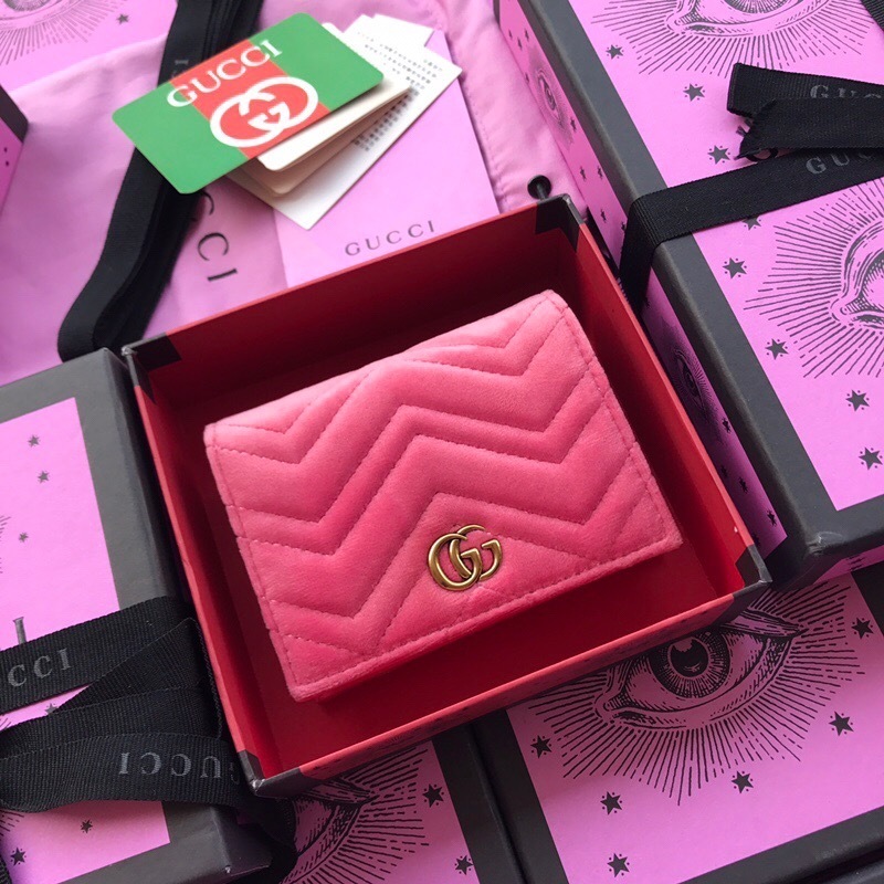 Gucci GG Marmont matelassé leather wallet in a pink (fuchsia) color with a gold-toned Double G logo
