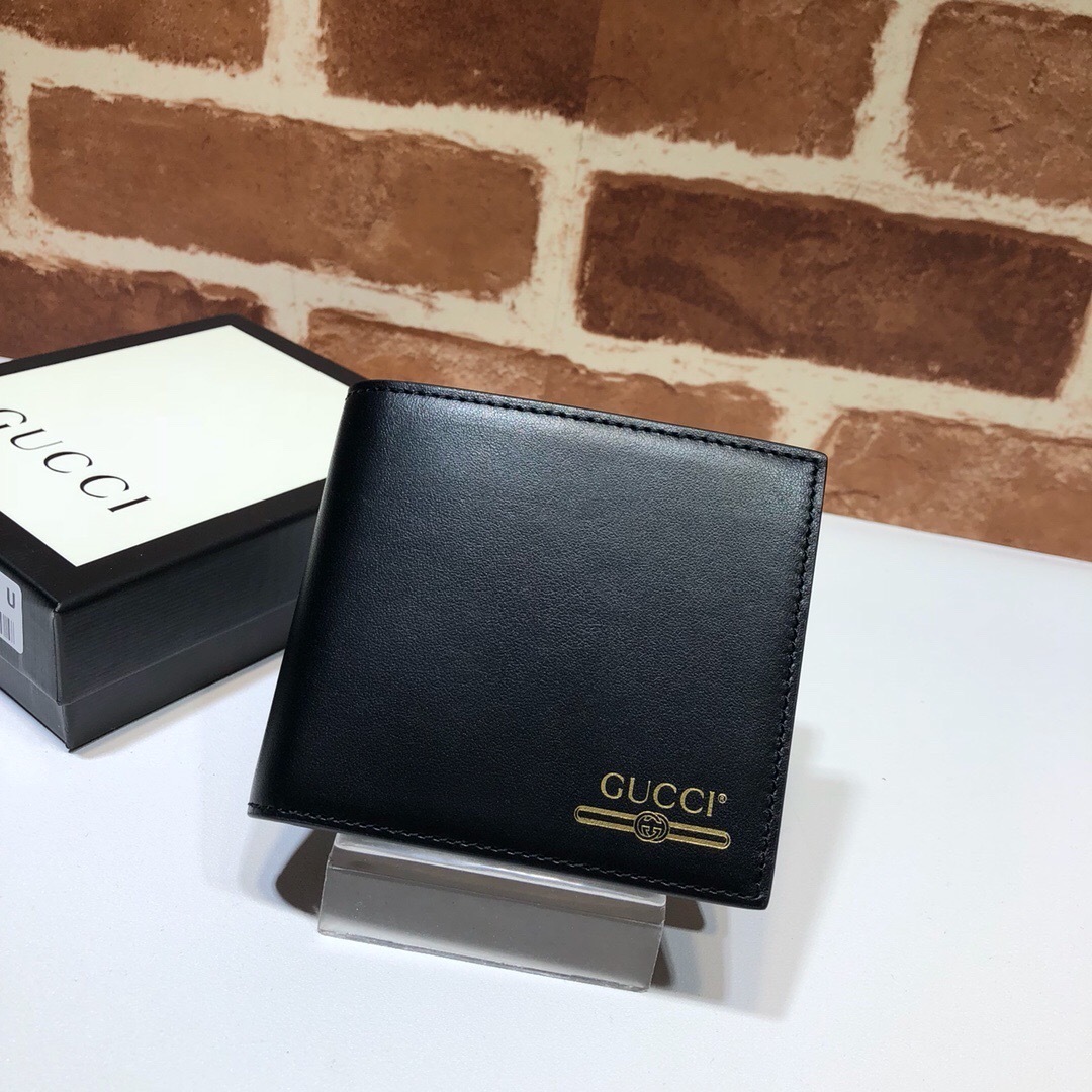 Gucci bifold wallet with a gold-tone logo print black leather