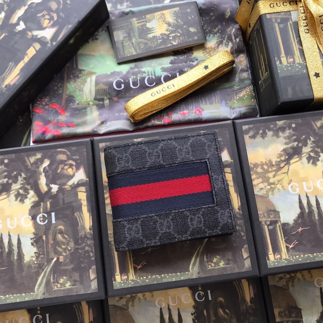 Gucci GG Supreme bifold wallet with the signature Web stripe design