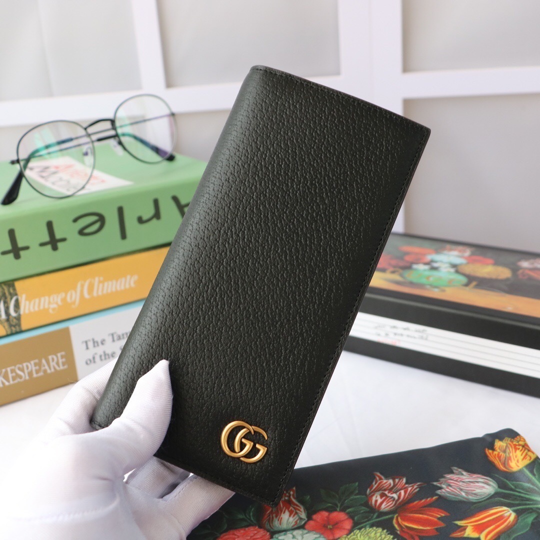 Gucci GG Marmont long wallet in black calf leather with a grained texture and a gold-tone Double G logo plaque