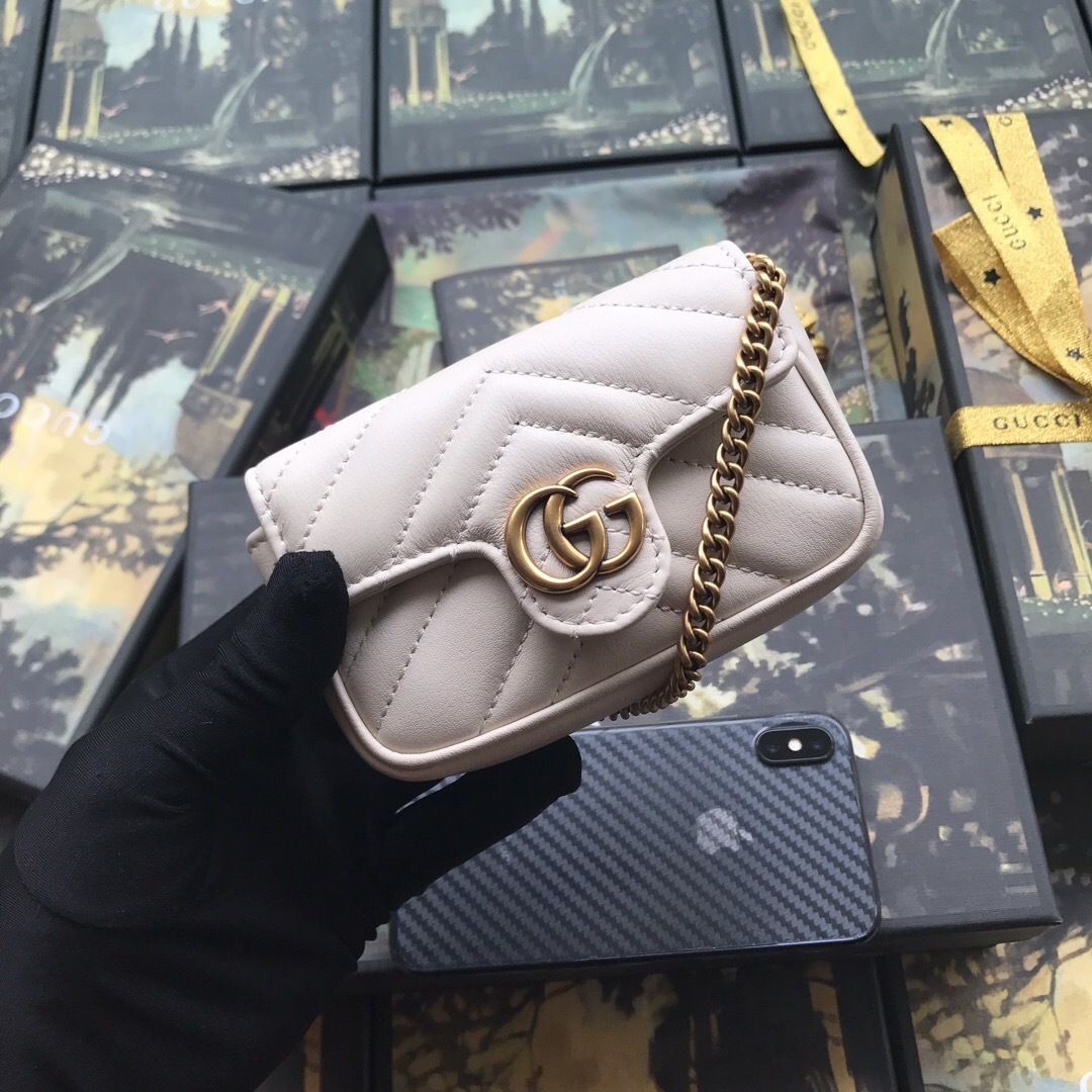 Gucci GG Marmont Super Mini shoulder bag in white matelassé calf leather with gold-toned hardware