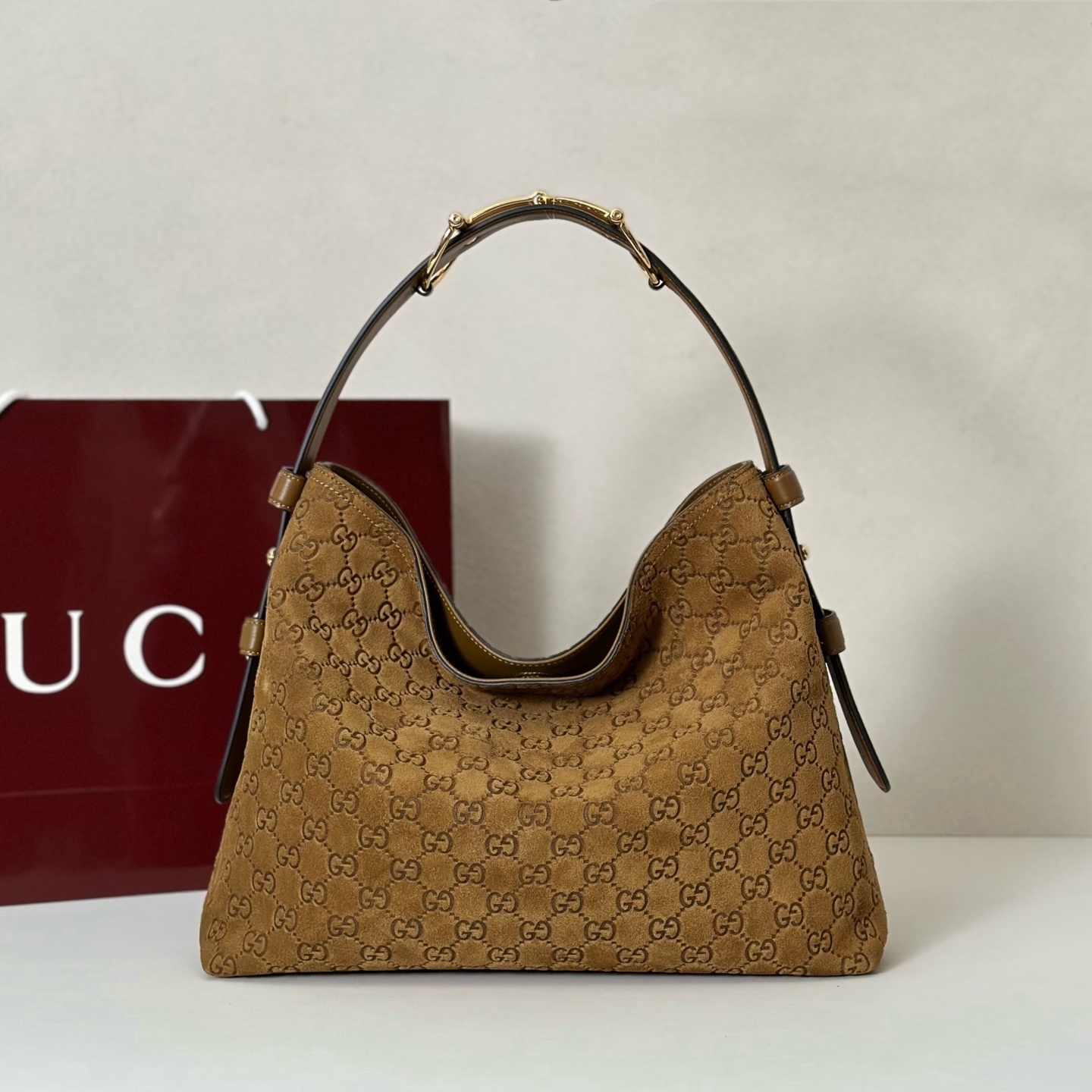 Gucci Beatrix shoulder bag brown suede with the all-over GG pattern