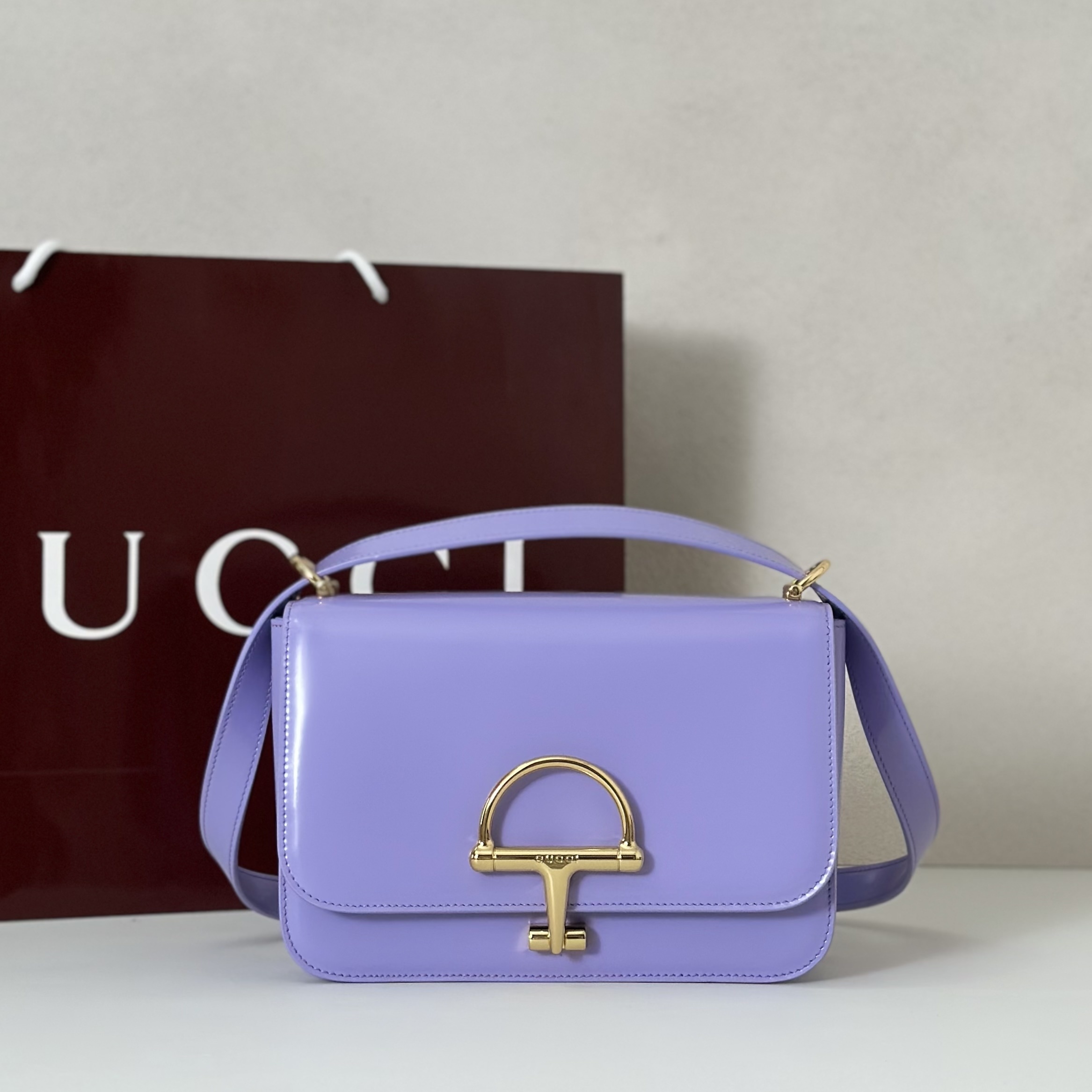 Gucci Siena leather shoulder bag in a purple (or lilac) color with gold-toned horsebit hardware