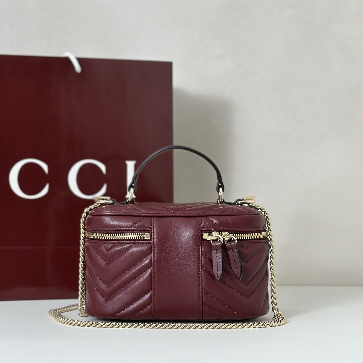 Gucci GG Marmont mini vanity bag in Rosso Ancora red matelassé chevron leather with light gold-toned hardware