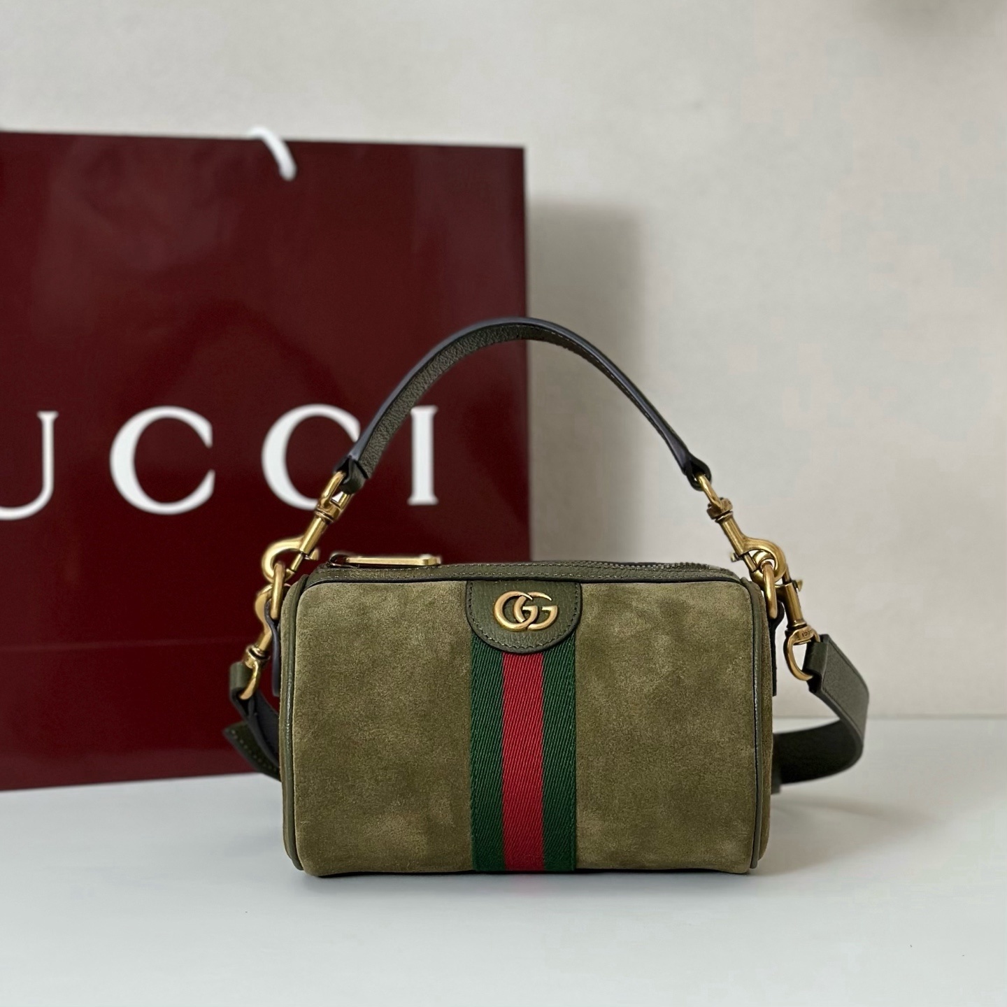 Gucci Ophidia mini handbag in green suede with a web stripe and gold-toned Double G detail