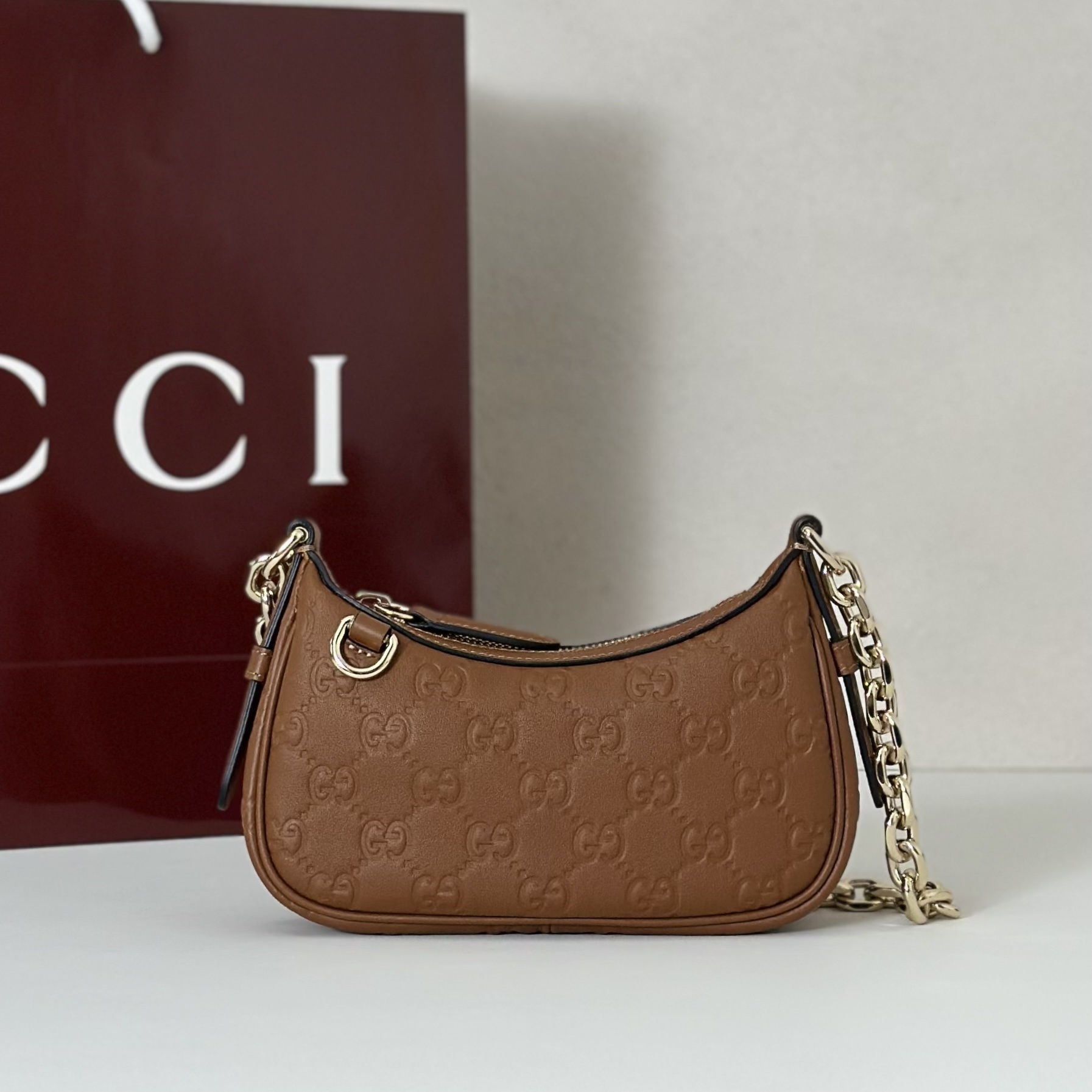 Gucci GG Emblem mini shoulder bag in brown leather