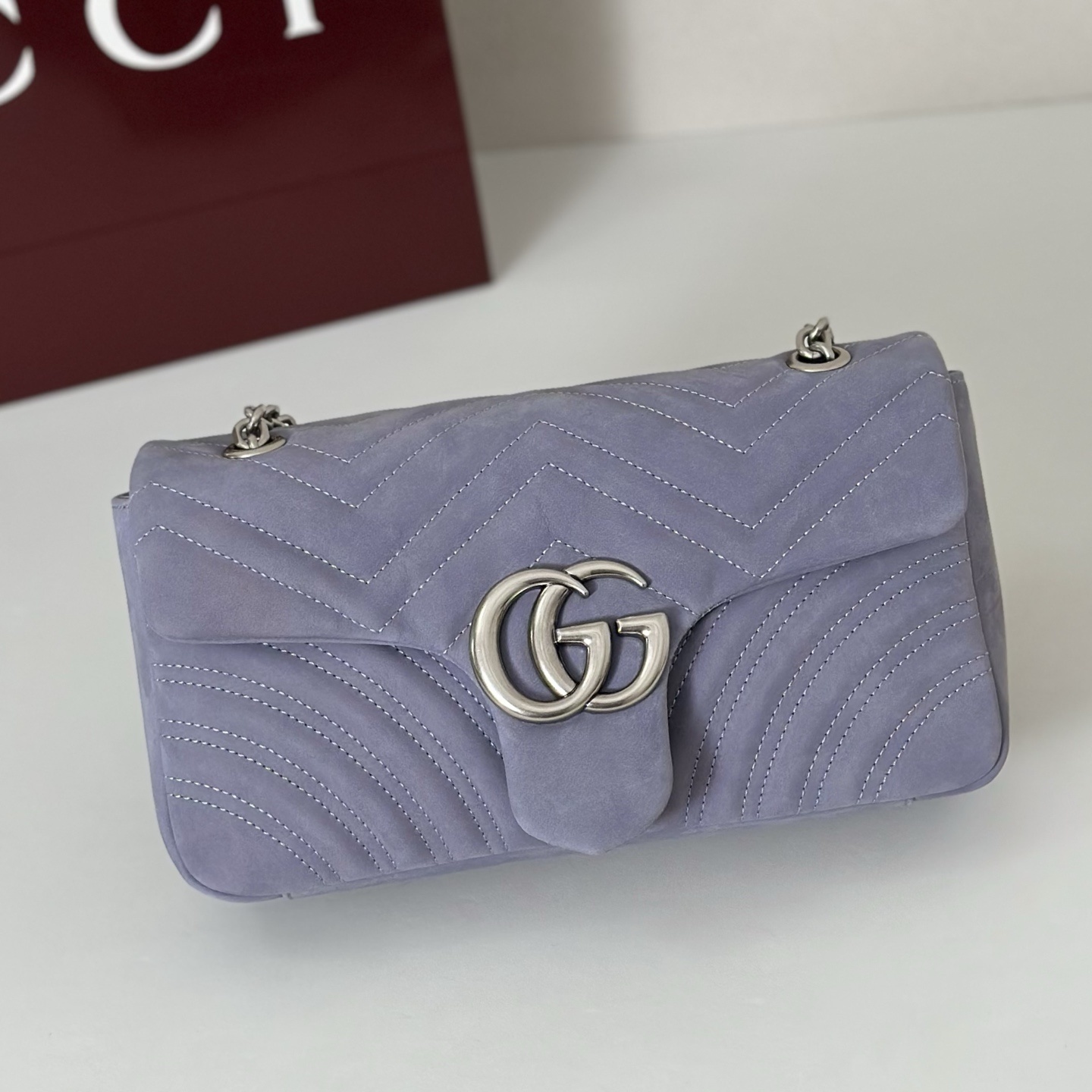 Gucci GG Marmont small shoulder bag in a pastel purple suede or leather with a silver-toned Double G logo