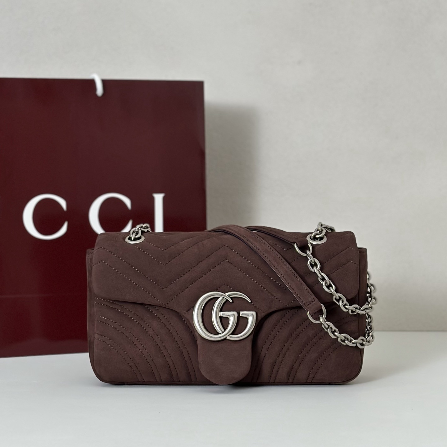 Gucci GG Marmont shoulder bag in a dark brown velvet material