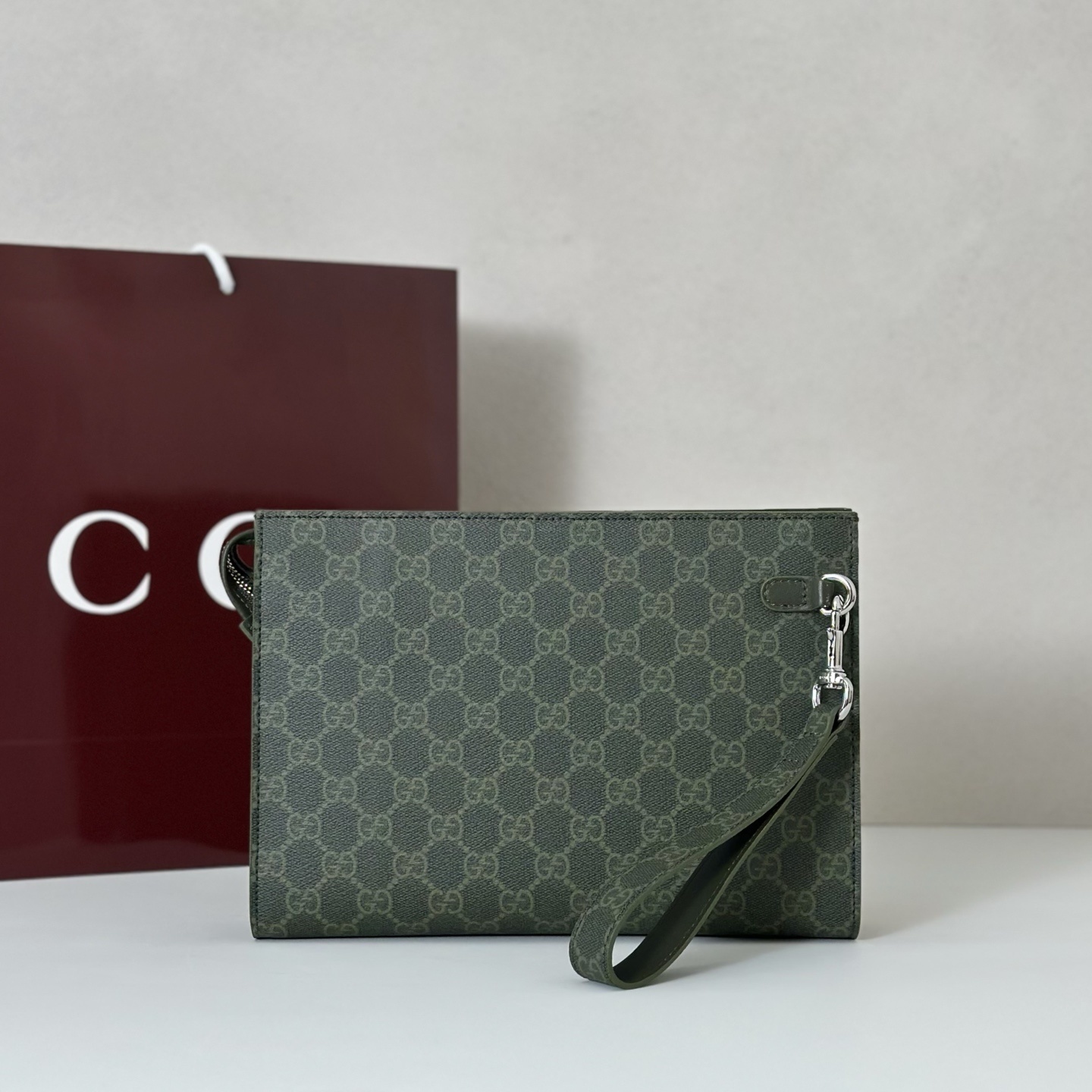Gucci small pouch in forest green GG monogram coated canvas with leather trim