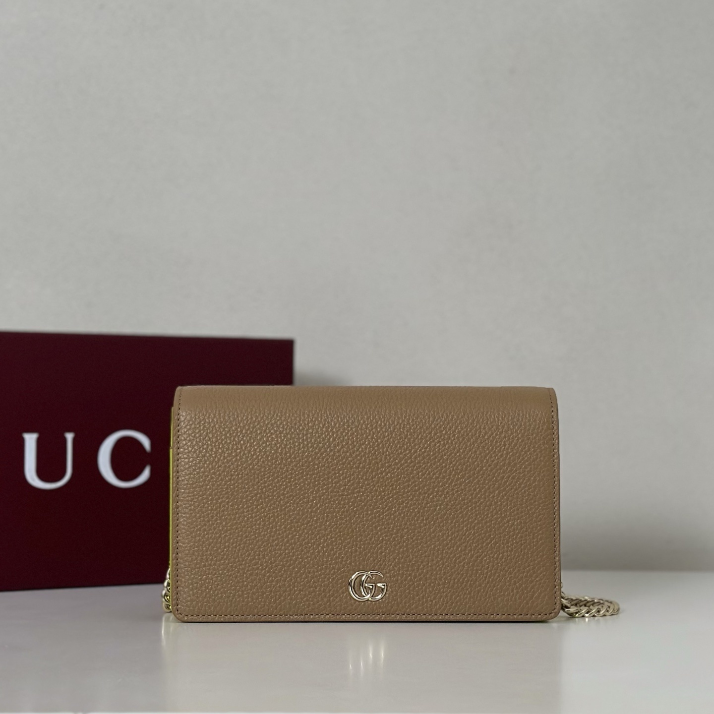 Gucci GG Marmont leather wallet on a chain