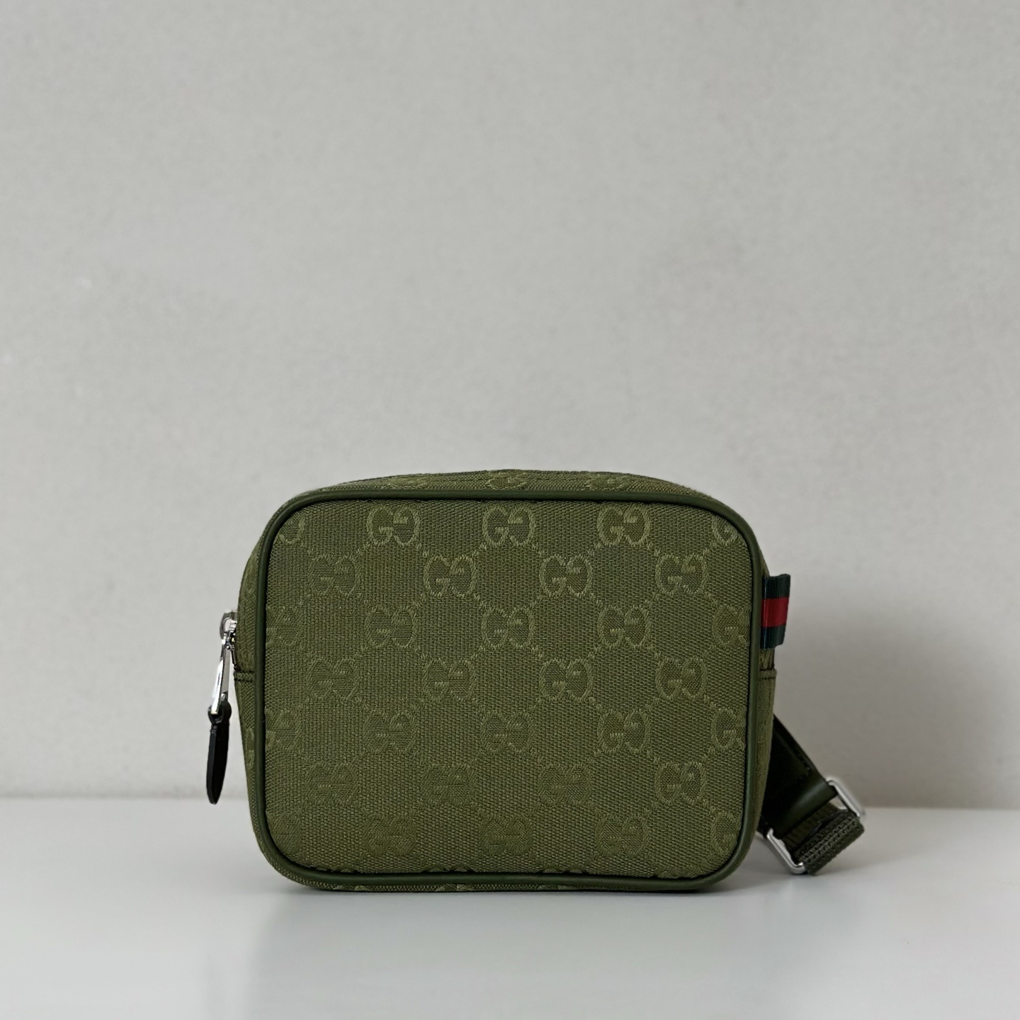 Gucci GG canvas mini bag in forest green with a green and red Web detail and brown leather trim