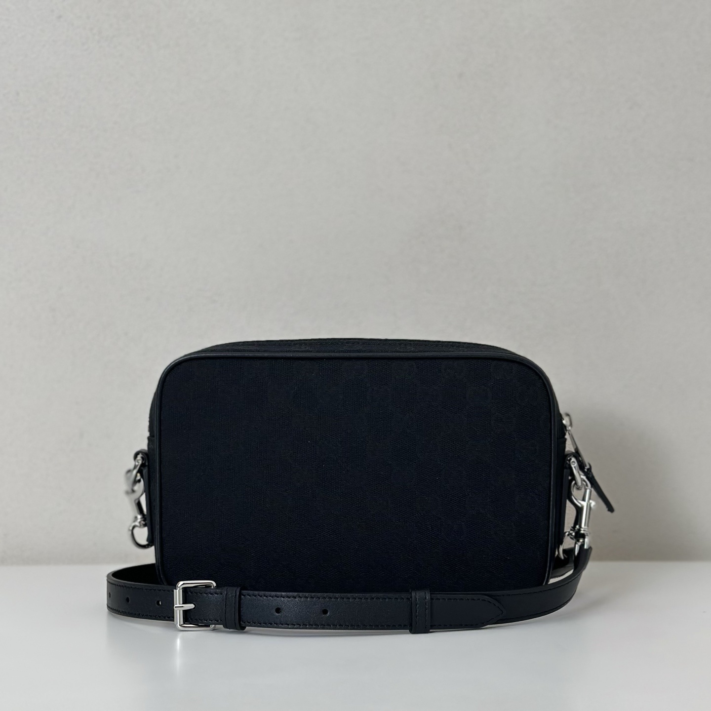 Gucci black canvas or leather crossbody camera bag with silver-tone hardware