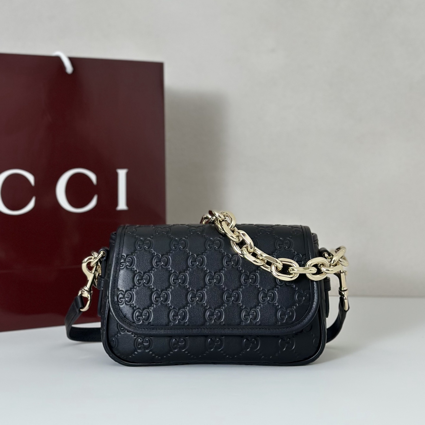 Gucci GG Emblem small shoulder bag in black GG leather
