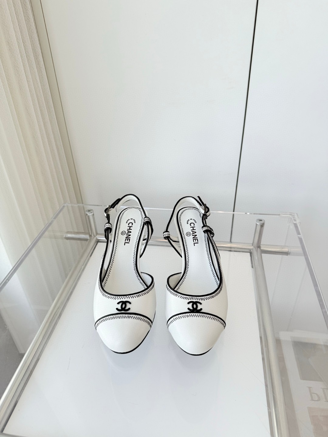 Chanel slingback pumps in white and black colorway