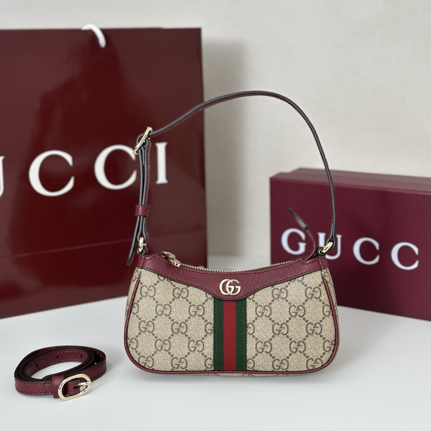 Gucci Ophidia mini bag in the GG Supreme canvas with red leather trim and the green and red Web stripe