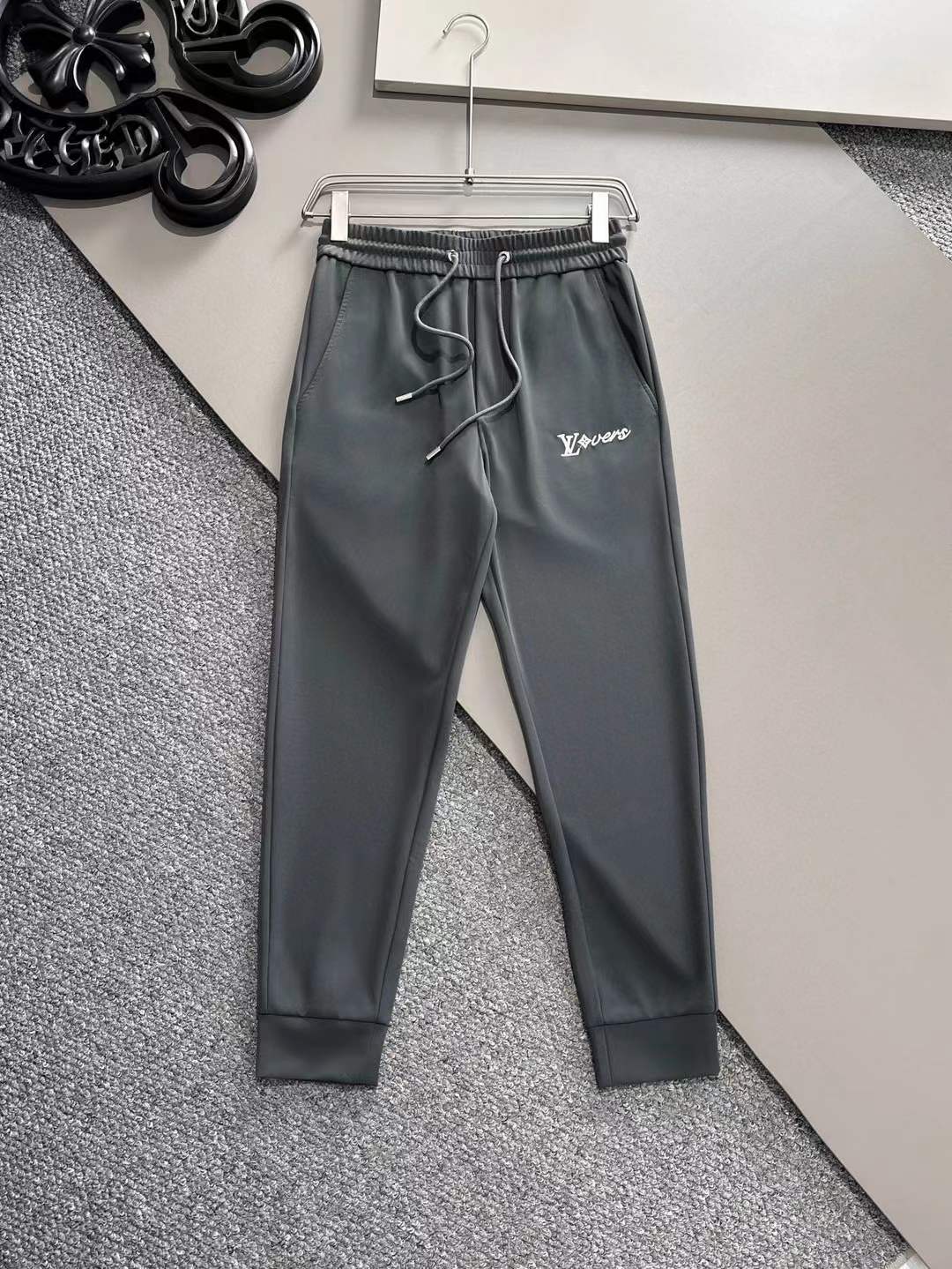 LV men's sweatpants in grey sports polyester lycra or a similar dri-fit 4-way stretchable material