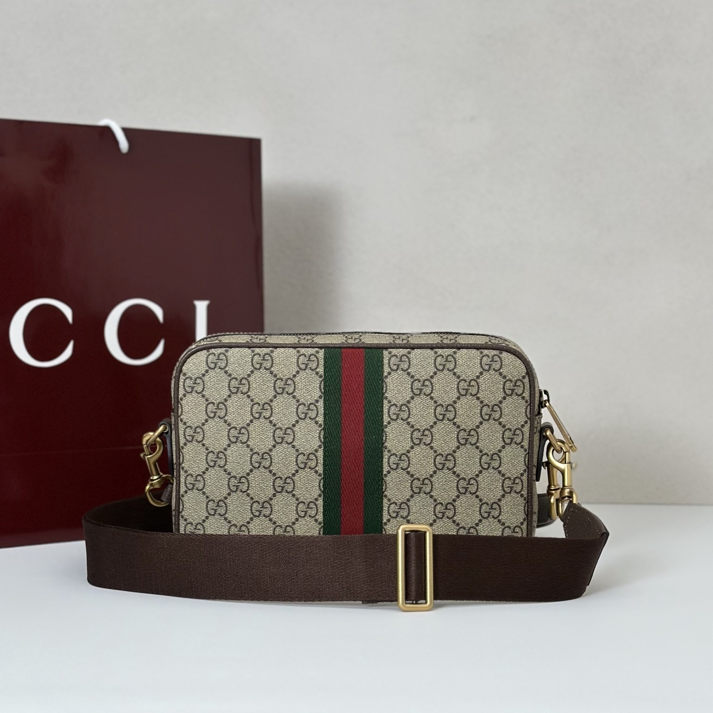 Gucci Ophidia Small Crossbody Bag in GG Supreme canvas with leather trim