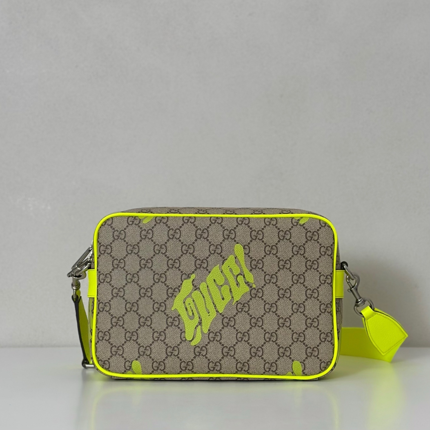 Gucci GG Medium crossbody bag with a neon yellow print