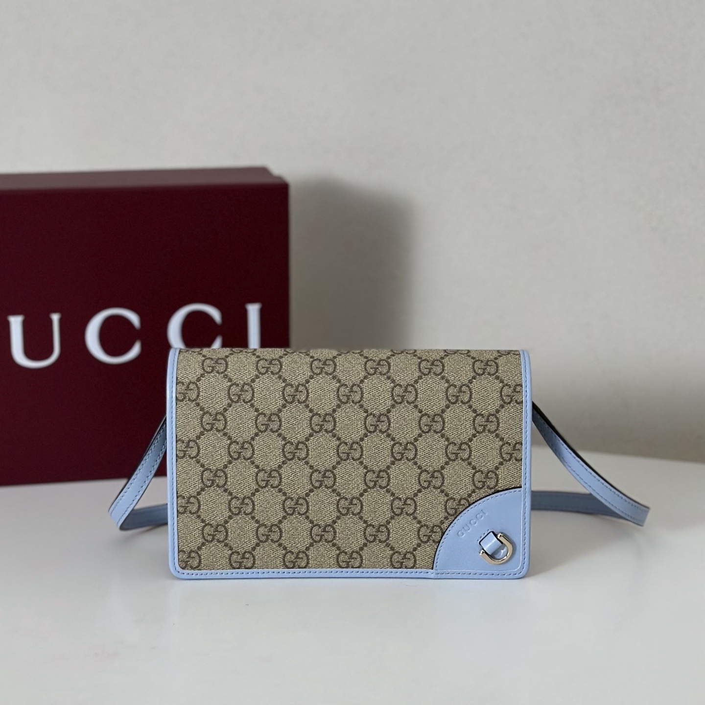 Gucci GG Emblem mini or small wallet in the beige and dark brown fabric with light blue leather trim