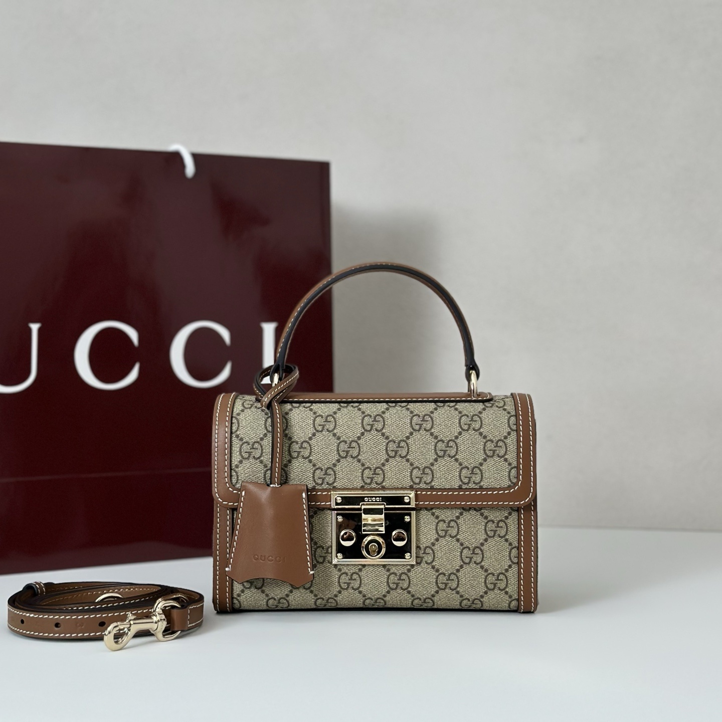 Gucci Padlock small top handle bag in beige and dark brown GG monogram coated fabric with brown leather trim