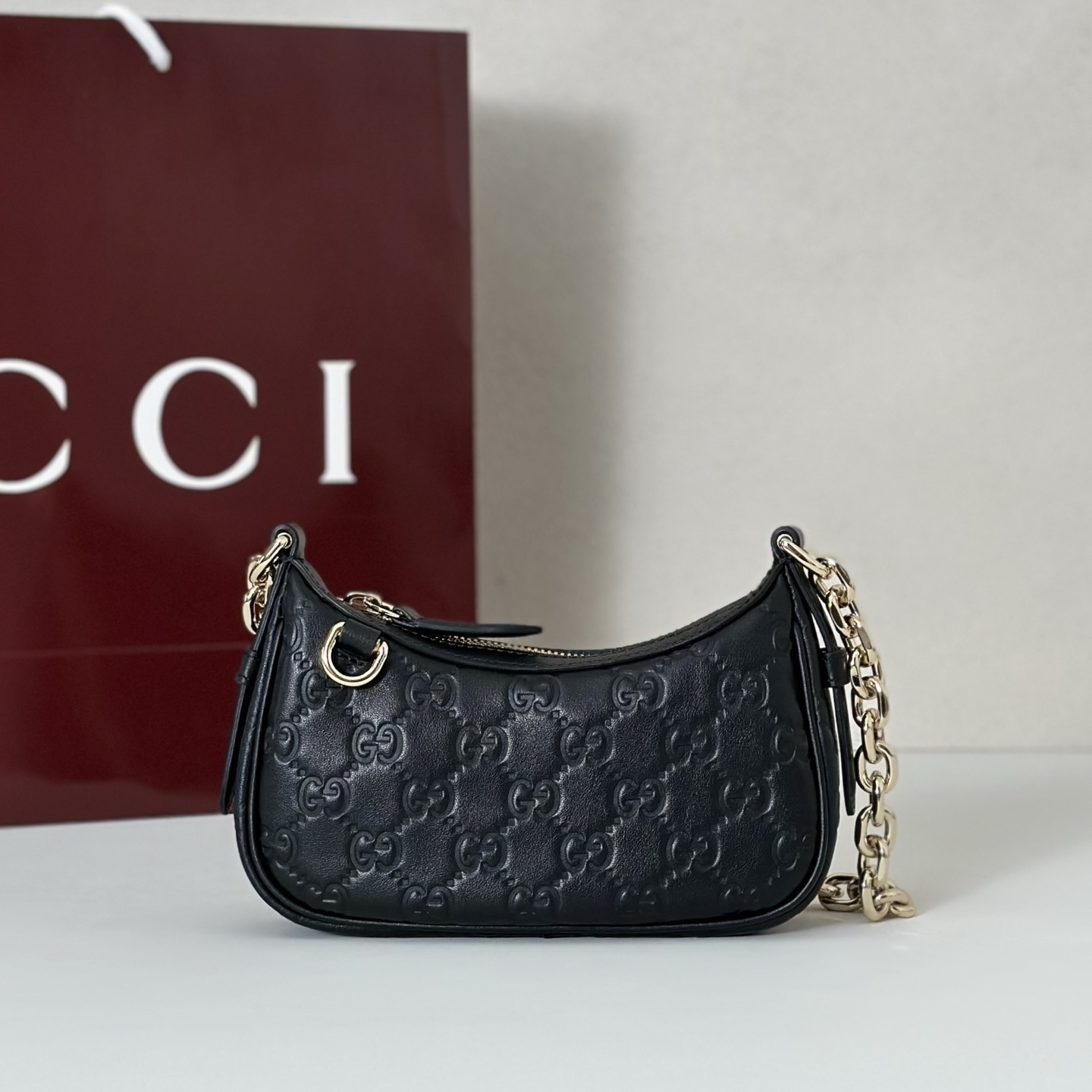 Gucci GG Emblem mini shoulder bag in leather