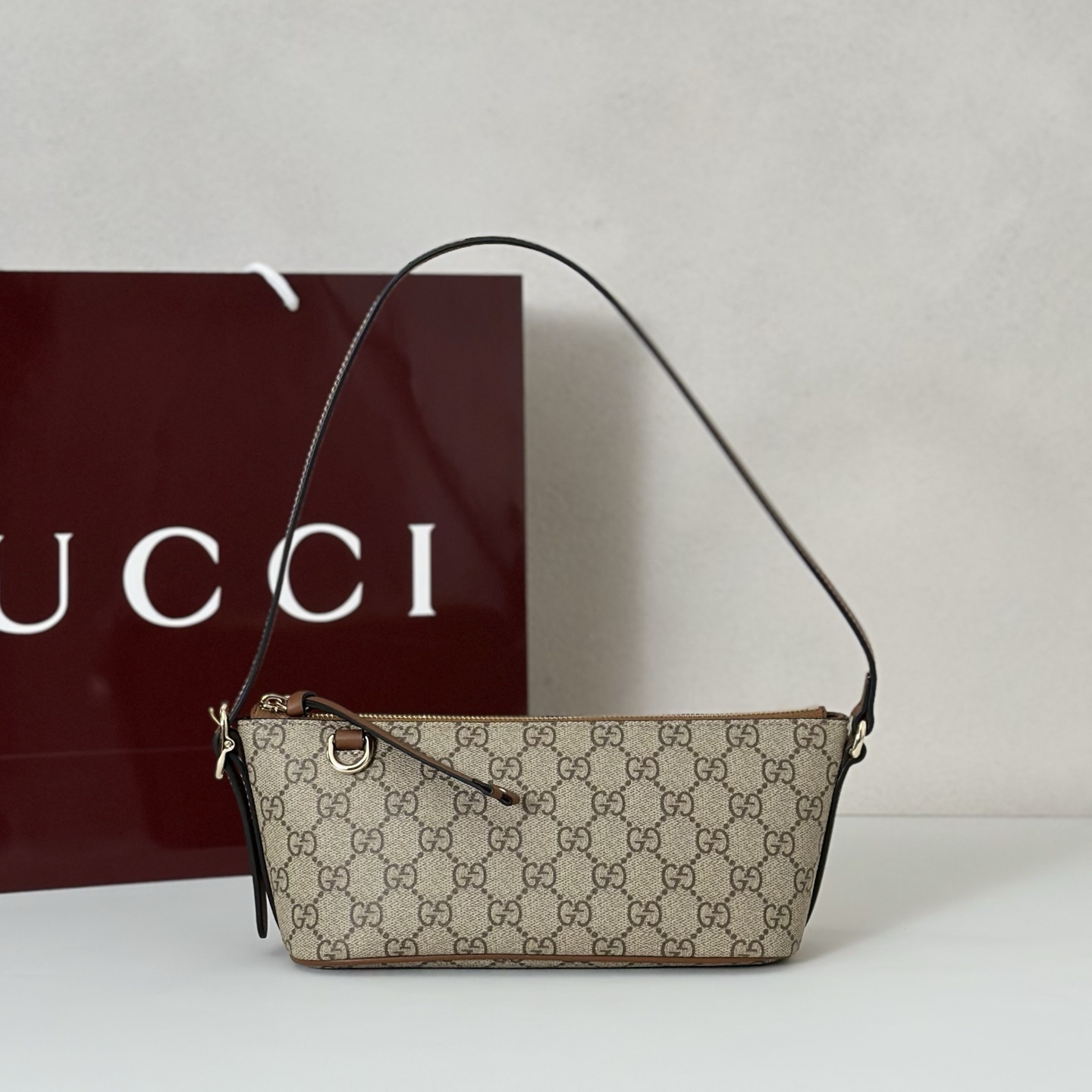 Gucci GG Emblem mini shoulder bag in beige GG canvas with leather trims
