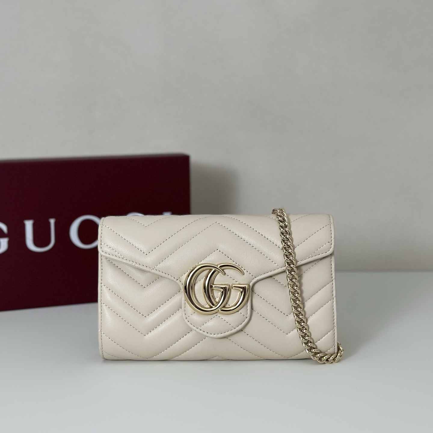 Gucci GG Marmont shoulder bag in a white or ecru matelassé leather