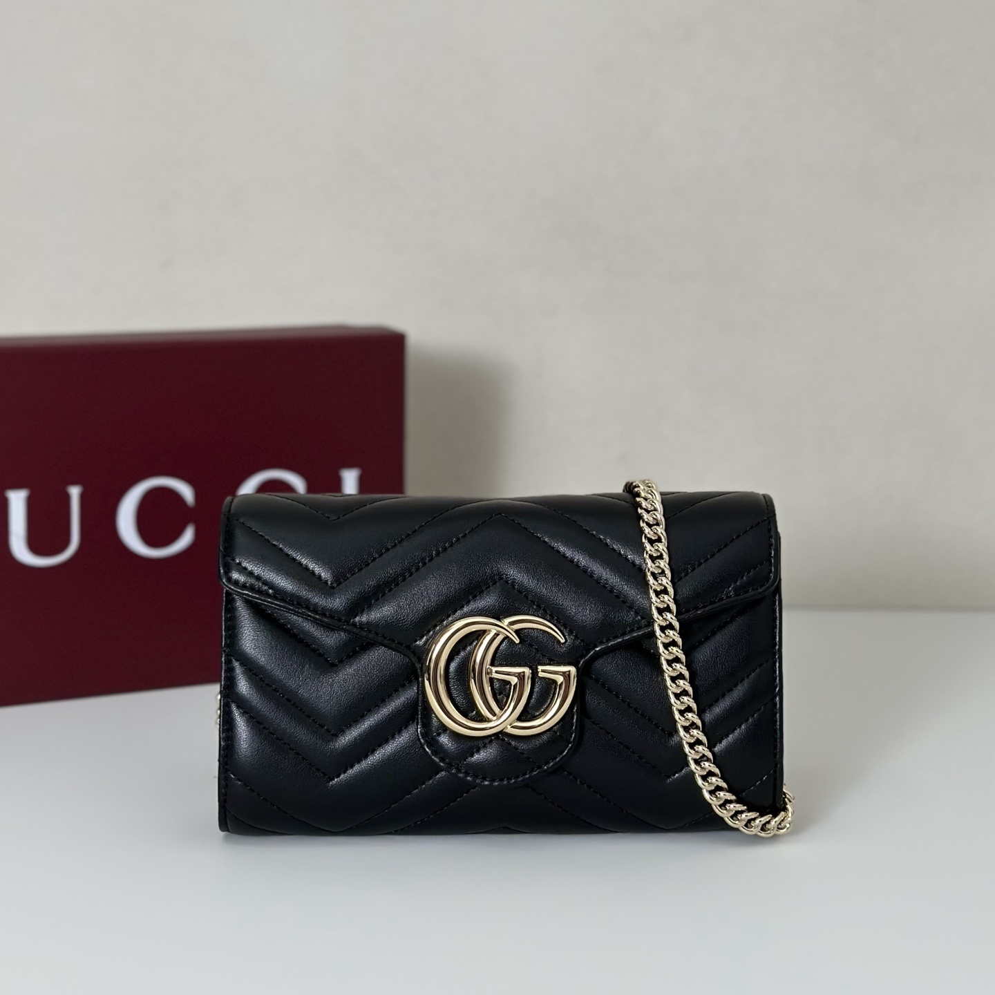 Gucci GG Marmont mini chain bag in black matelassé leather with gold-toned hardware