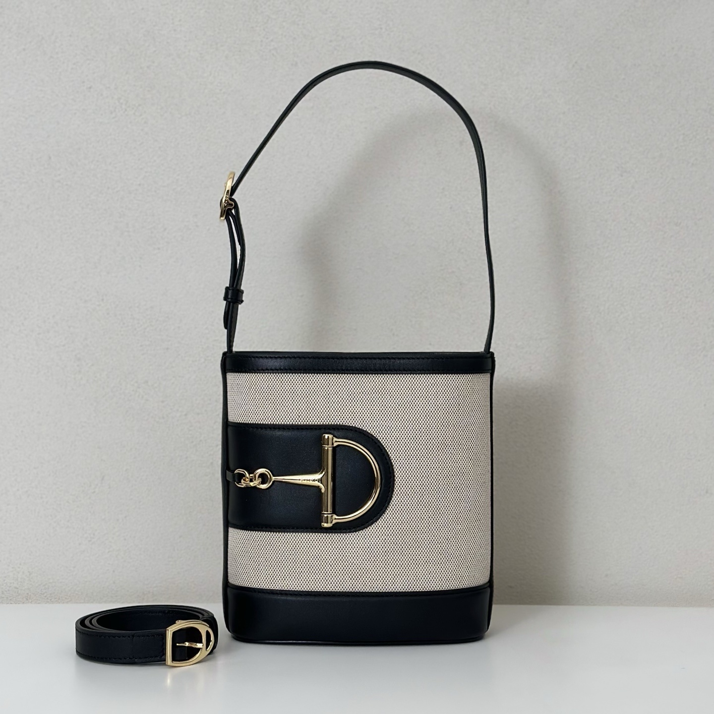 Gucci 73 mini bucket bag in black leather and canvas