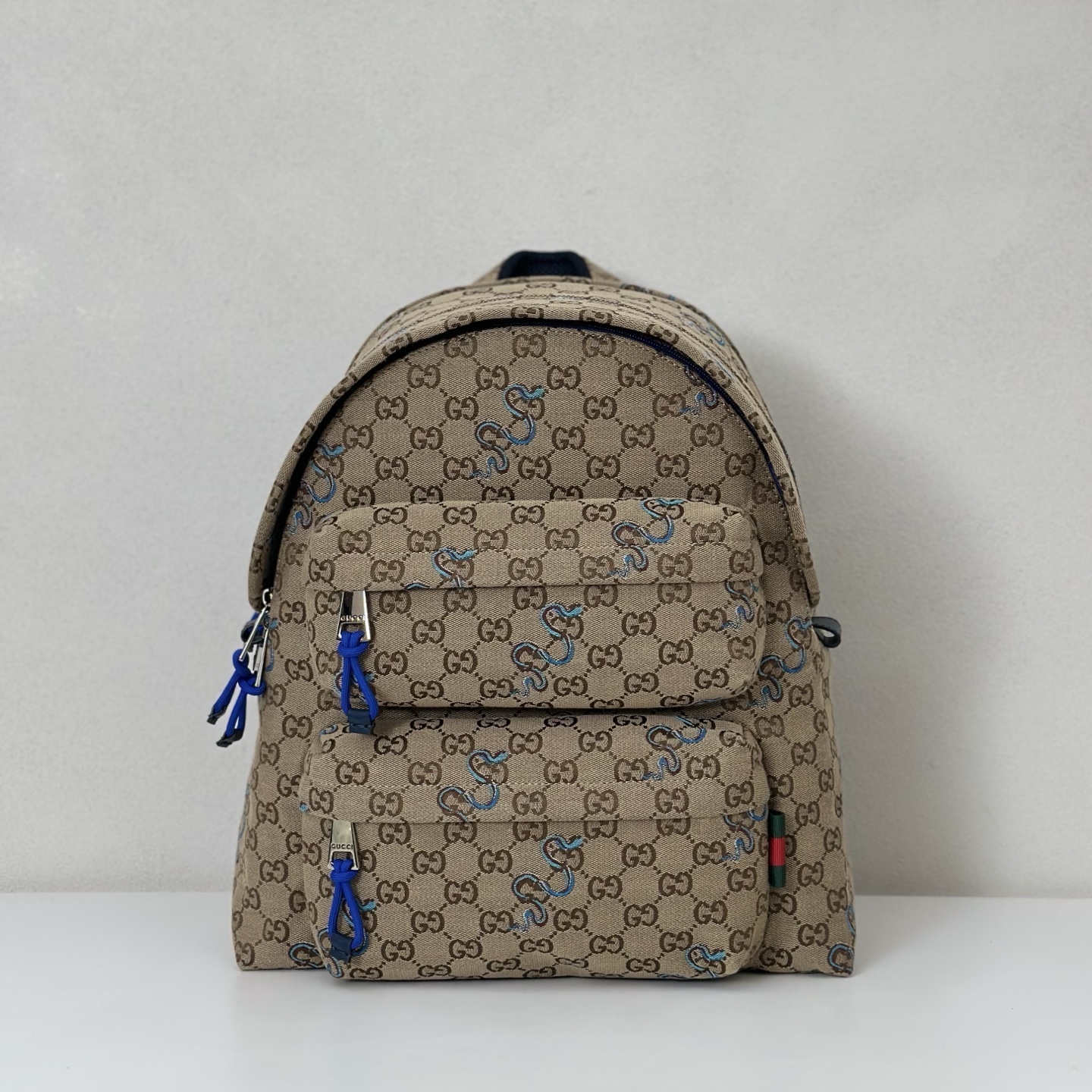 Gucci GG Supreme canvas backpack with blue doodle-style accents