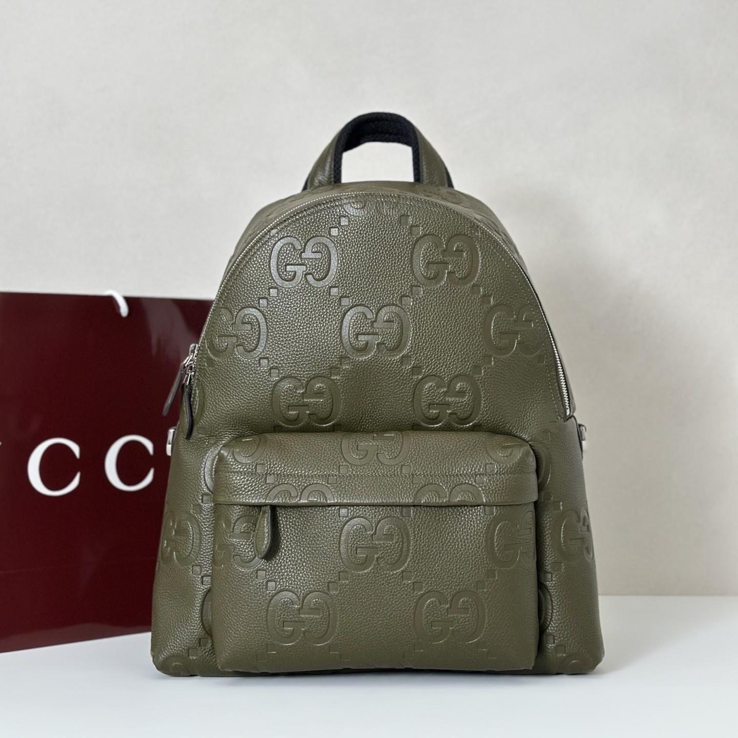 Gucci medium Jumbo GG backpack in green grainy leather