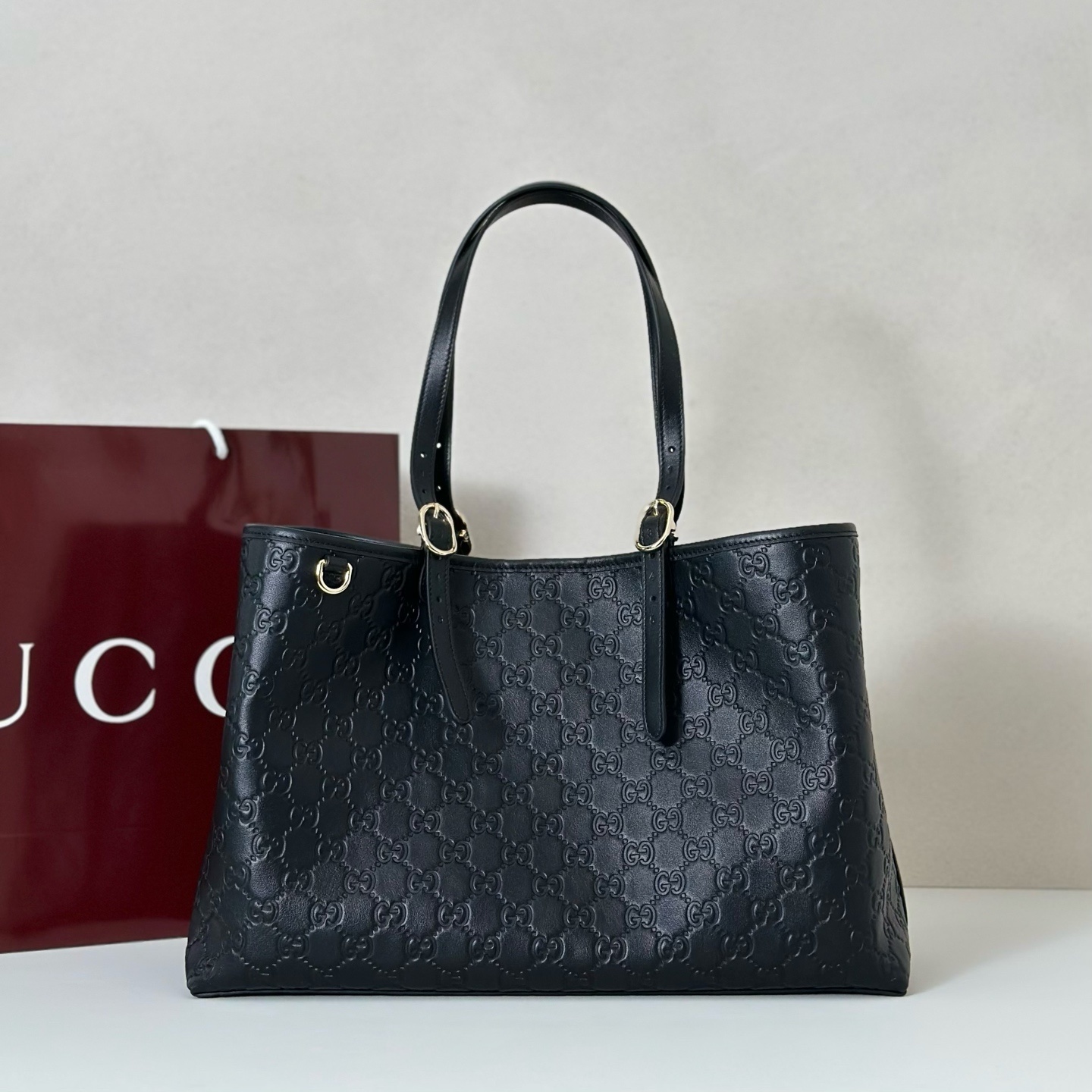 Gucci large GG Emblem tote bag in black embossed leather