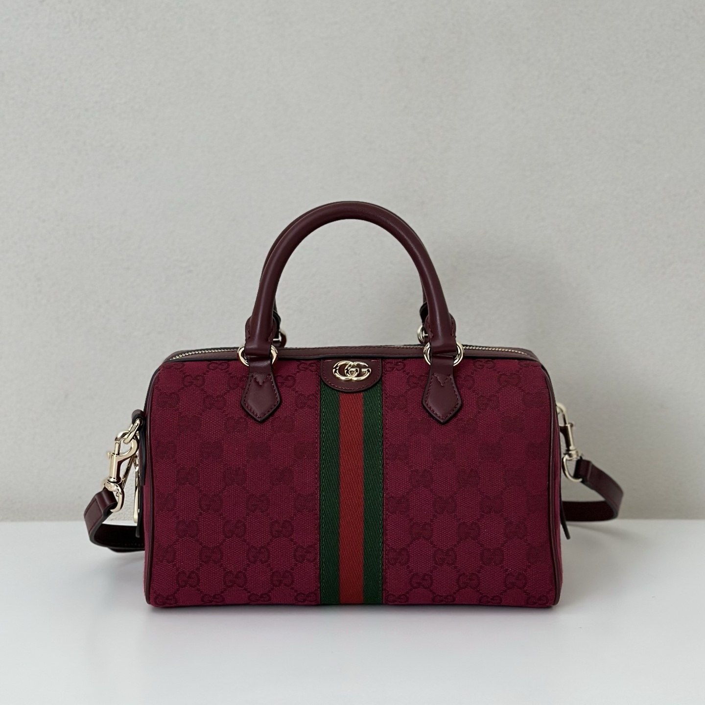 Gucci Small Ophidia Top-Handle Bag in a red or burgundy GG canvas