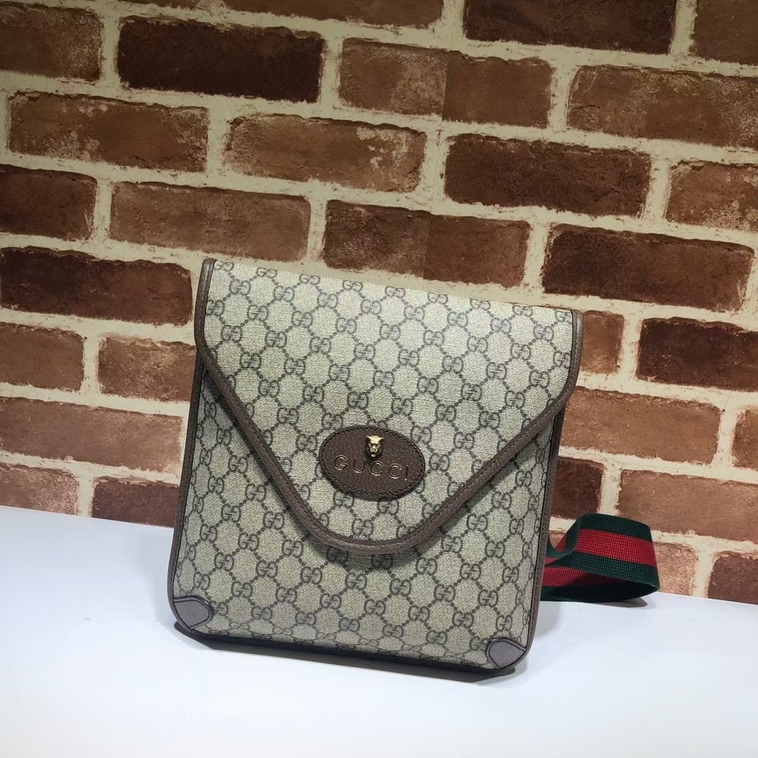 Gucci Neo Vintage GG Supreme medium messenger bag in beige and ebony canvas with brown leather trim.