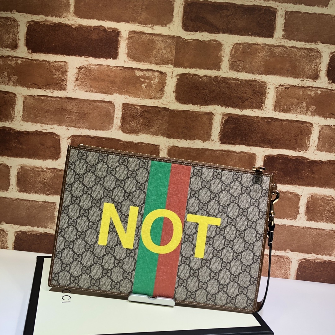 Gucci Ophidia GG Supreme canvas clutch with web stripe and "FAKE" print