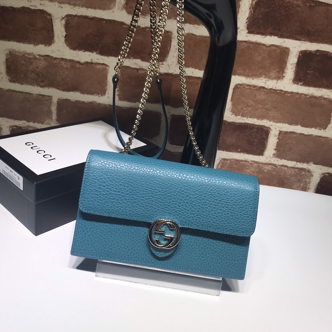 Gucci Interlocking G medium blue pebbled leather crossbody bag/wallet on chain