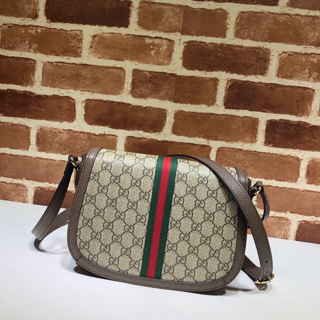 Gucci Ophidia GG small shoulder bag in beige and ebony GG Supreme canvas with brown leather trim, gold-toned hardware, and the signature green and red Web stripe