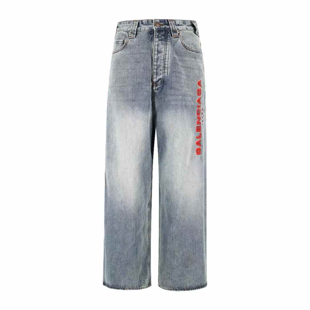 Balenciaga baggy wide-leg jeans in a light blue washed cotton denim with a red logo on the side