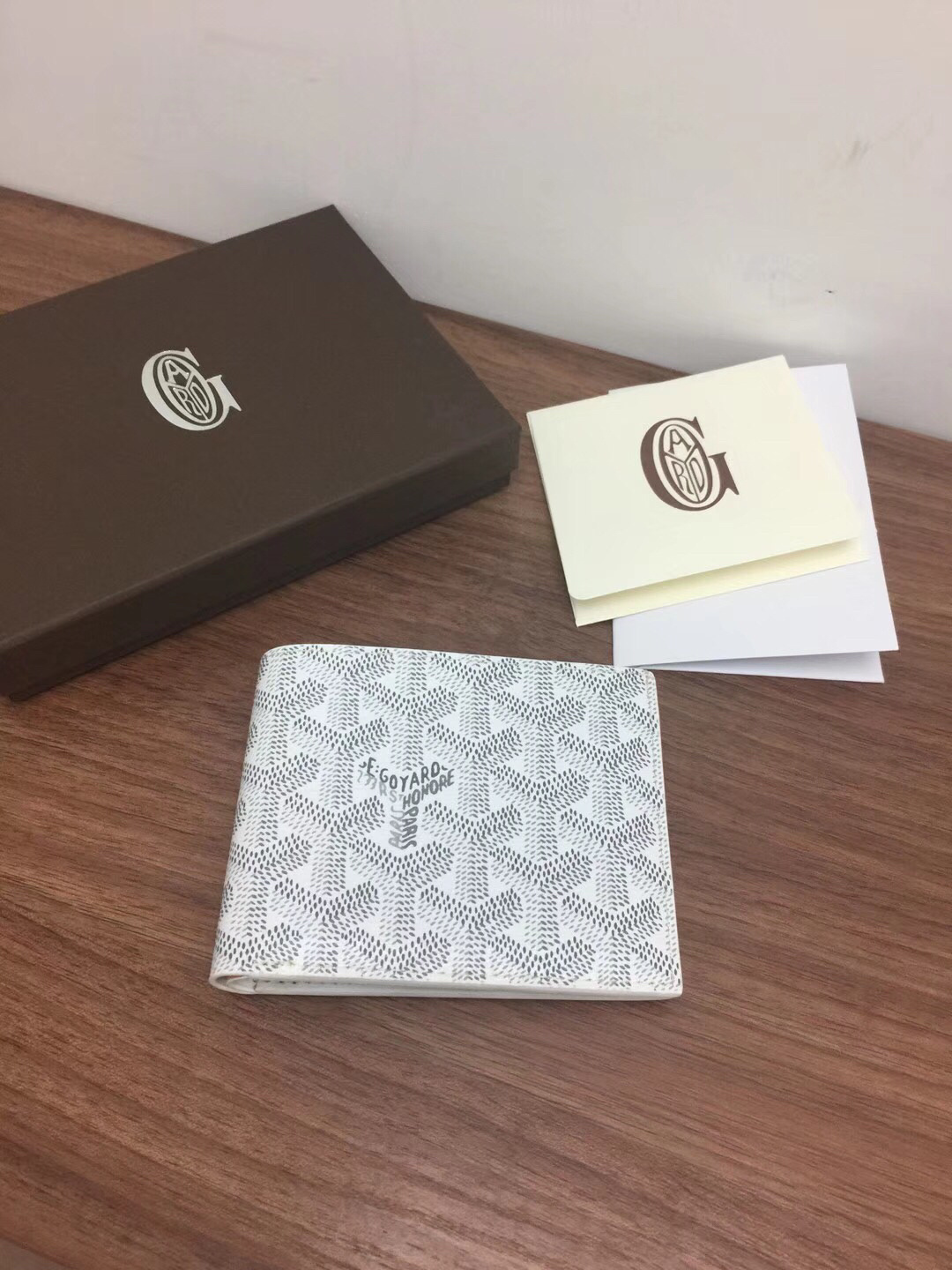 Goyard Victoire wallet in white Goyardine canvas.