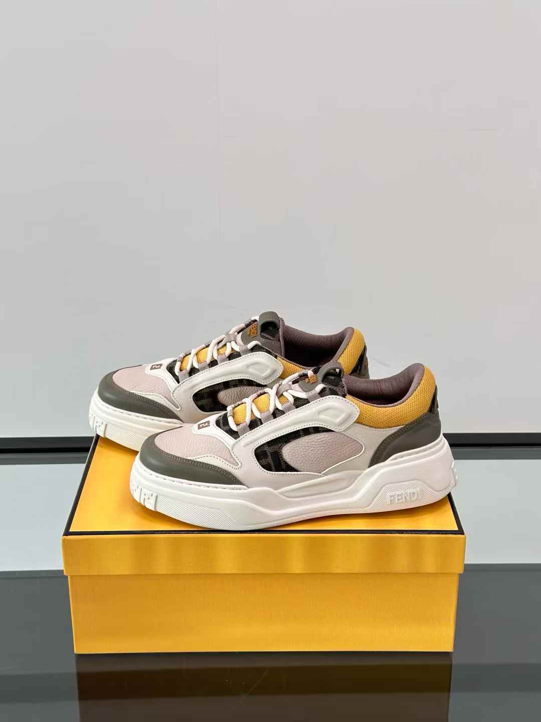 Fendi Force low-top sneakers in white, brown, and yellow leather with FF jacquard details